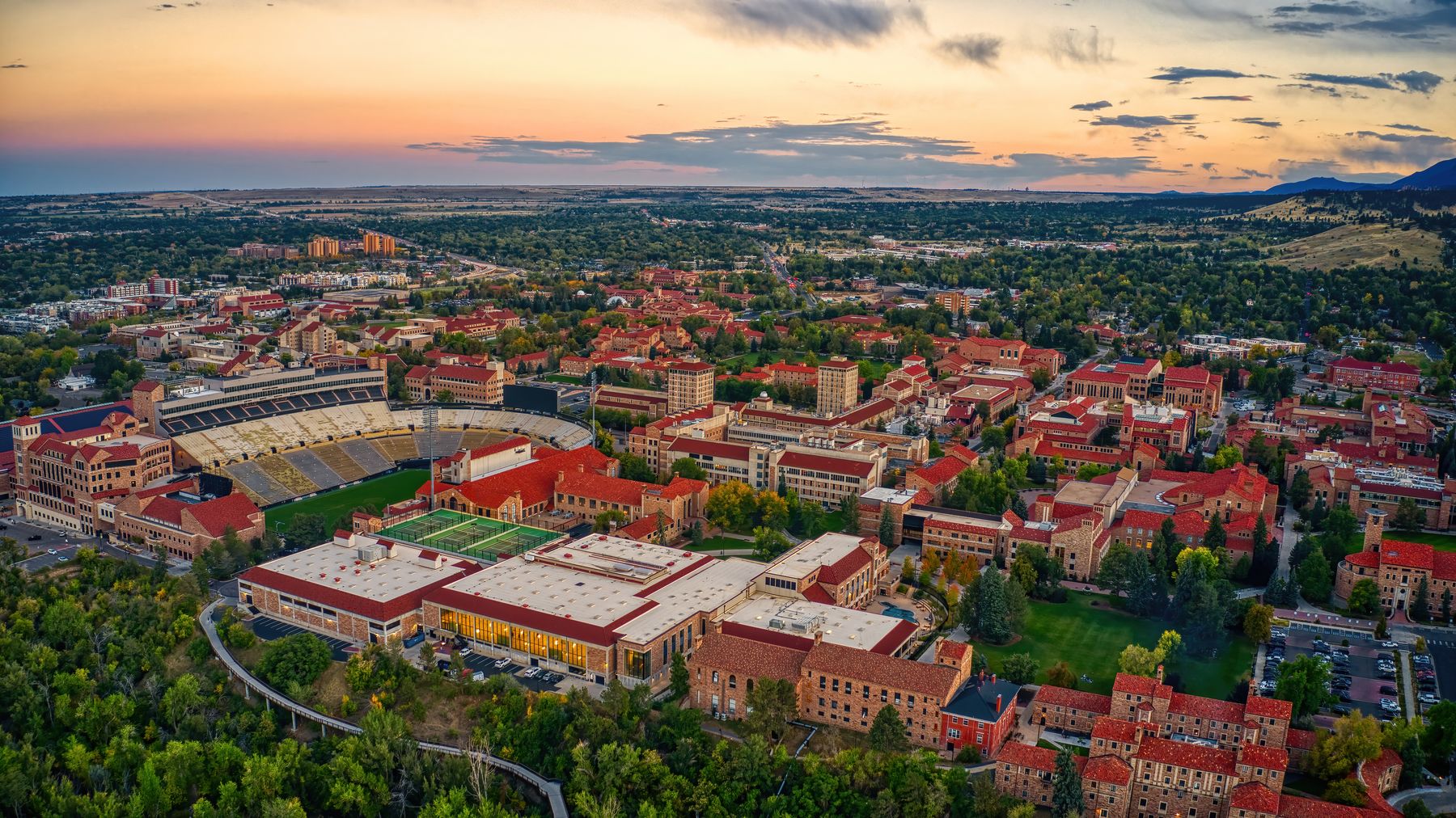 Aerial view of a college campus at sunset
