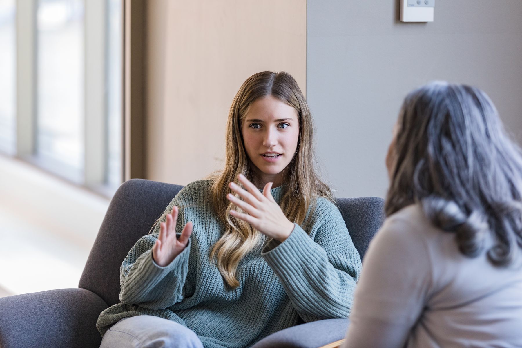 A student talking with an older classmate